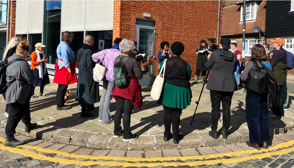 Member of Origins Untold hosting a walking tour at the harbour, Folkestone
